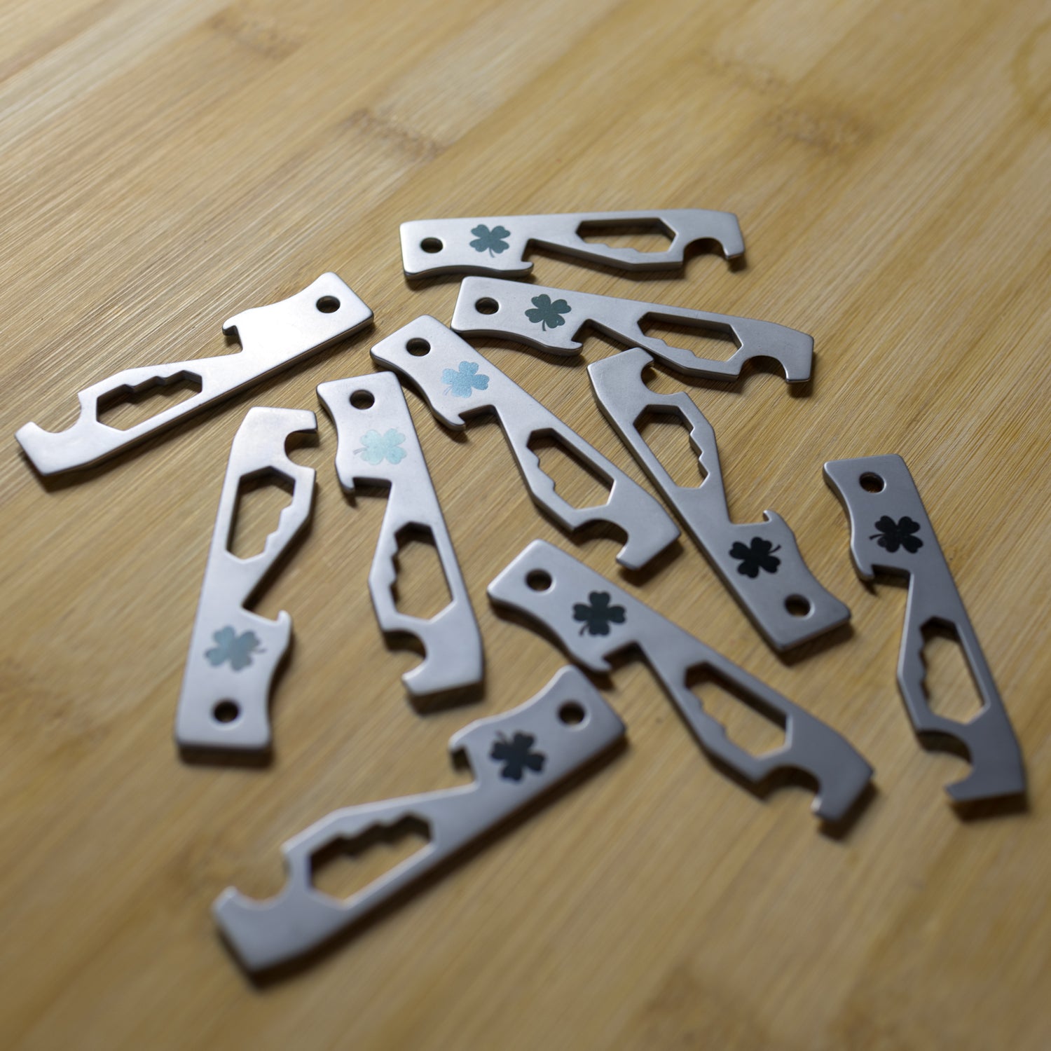 Many custom engraved green shamrock MOCA 10-in-1 keychain multi-tools