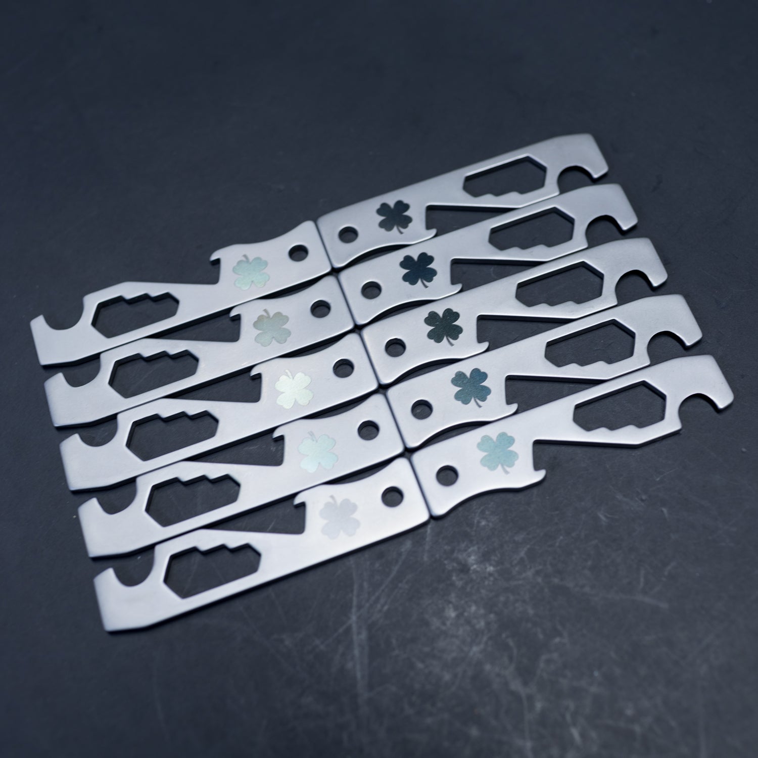 10 custom engraved Shamrock MOCA Tools back-to-back