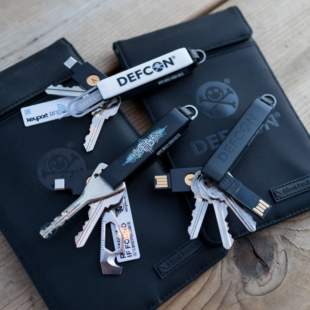 3 DEF CON Keyport Pivot 2.0s with keys and pocket tools plus SLNT RFID shielding go dark pouches