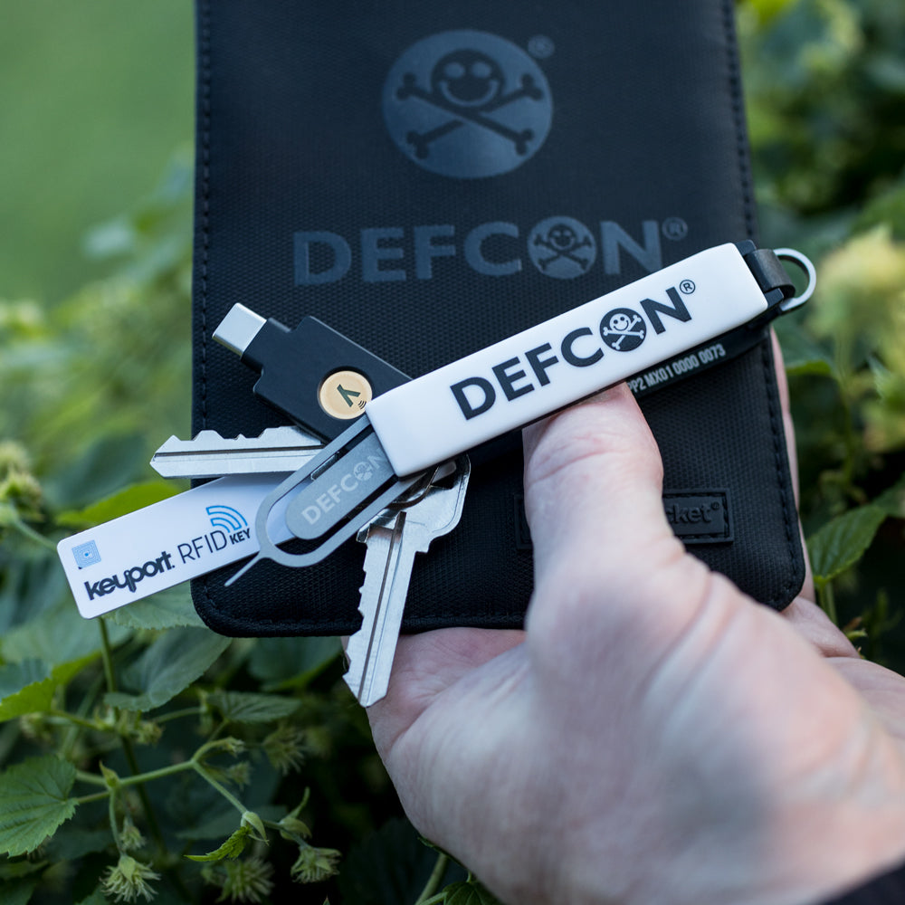 White DEF CON Keyport Pivot 2.0 key organizer with SLNT RFID shielding go dark phone pouch