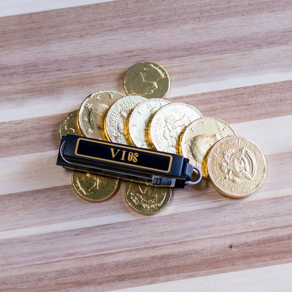Keyport Faceplate with Very Important Keyporter text and a pouch coins design