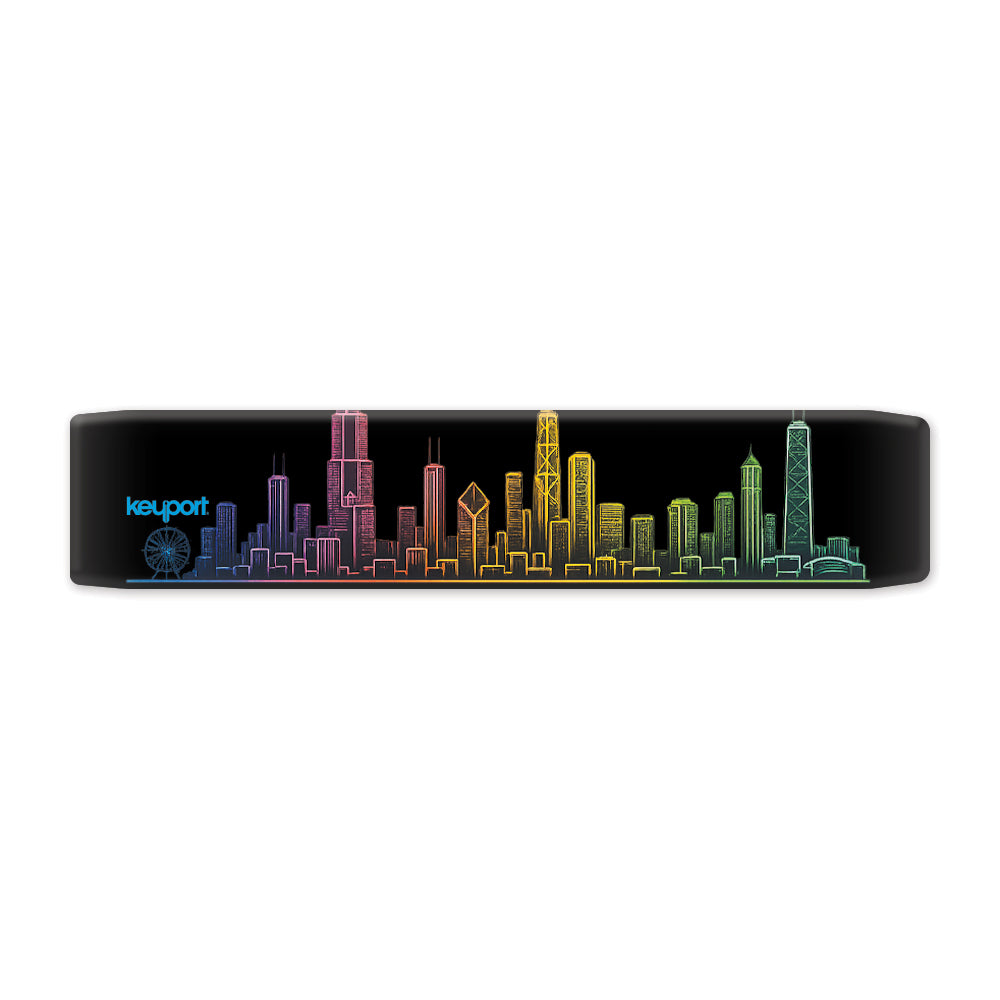 Keyport Chicago Skyline Faceplate showing a neon rainbow line drawing of Willis Tower, John Hancock Center, Aon Center, and the Navy Pier Ferris wheel on a matte black background.