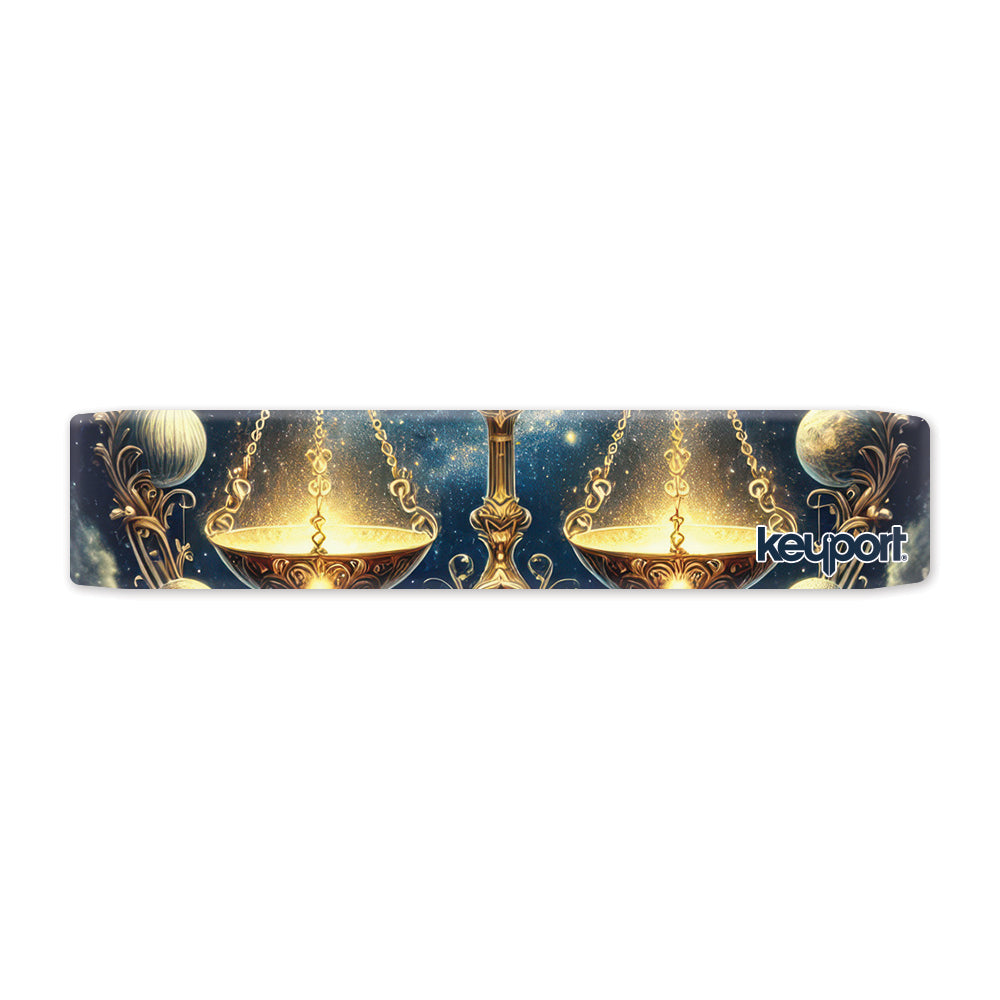 Keyport Libra Zodiac Faceplate: ornate golden balance scales with glowing pans and planets on a blue starfield