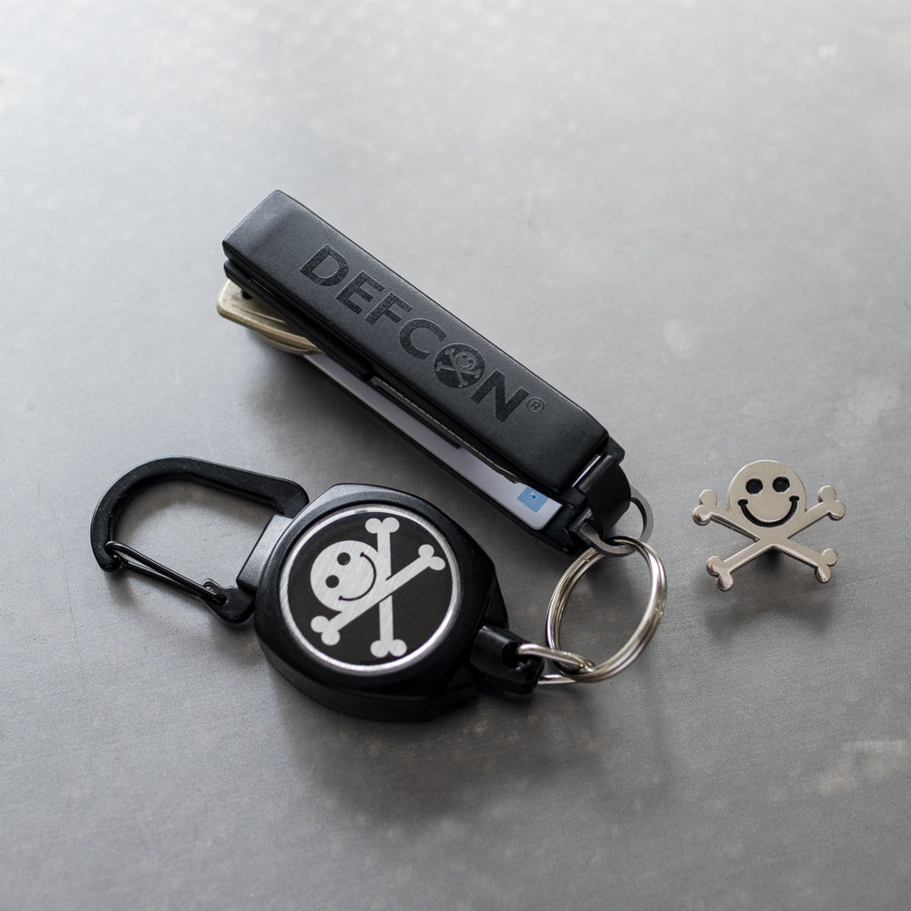 Blackout DEF CON Keyport Pivot key organizer with DEFCON Jack mini-reel and Jack pin